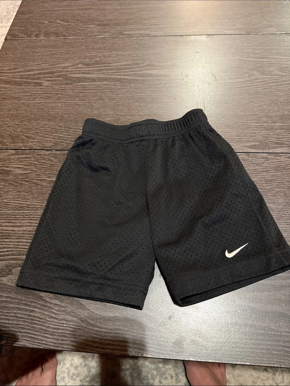 Nike Black Mesh Athletic Shorts with White Swoosh